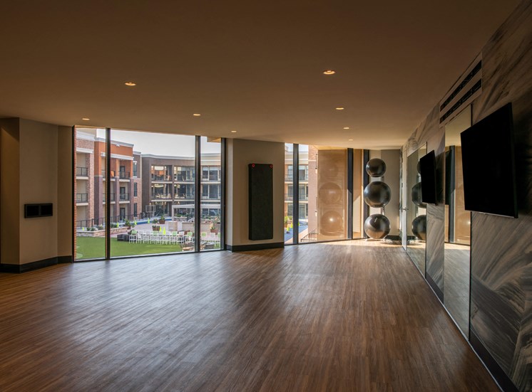empty studio space with large windows and hardwood floors